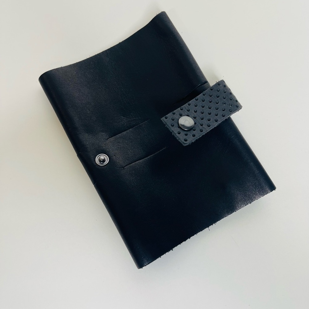 This is Ground Leather  Tech Cord Wrap Pouch